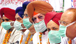 Truck operators and members of the All-India Motor Transport Congress sit in dharna in support of their demands on the eighth day of the nationwide strike.