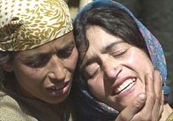 Relatives of Bashir Ahmad wail after his death
