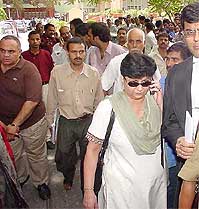 Relatives of the victims of Uphaar fire tragedy come out of the Delhi High Court 