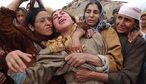 Relatives of Fatima wail in Chackseeri after her death in an explosion at Pattan, 30 km north of Srinagar, on Friday.