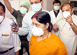 Union Minister for Health Sushma Swaraj with officials coming out from the SARS ward of Maharishi Balmiki Infectious Diseases Hospital