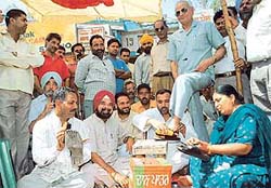 Punjab BJP chief Brij Lal Rinwa, gets his shoes shined