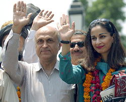 Pakistani parliamentarians wave at mediapersons after crossing into India at Wagah on Thursday.