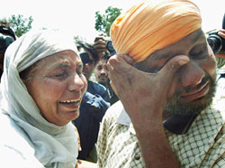 Surinder Singh weeps after meeting his mother at Wagah on Sunday. 