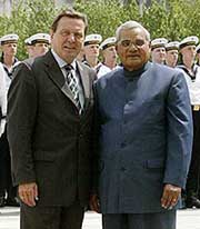 Prime Minister Atal Bihari Vajpayee and German Chancellor Gerhard Schroeder pose for the media in front of German Parliament Reichstag in Berlin on Wednesday