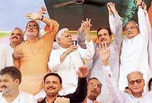 Mr Bhupinder Singh Hooda, Mr Birender Singh, Mr Natwar Singh, Mr Jai Parkash and Mr Anand Singh Dangi join hands at a rally