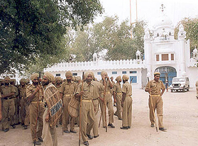 Heavy police deployment outside Baba Nihal Singh Gurdwara during curfew at Talhan village in Jalandhar on Sunday.
