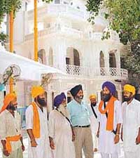 Happiness returns to Gurdwara Baba Nihal Singh as agreement is reached between the Dalits and the Jats on Saturday. In the picture are the Head Granthi and sevadars.
