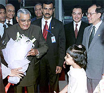 Prime Minister Atal Bihari Vajpayee being greeted by a little girl on his arrival