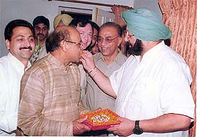 Punjab Chief Minister Capt Amarinder Singh felicitates Sant Ram Singla, the newly appointed Punjab Mandi Board chairman