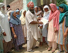 Dalbir Kaur, widow of Bhindranwale Tiger Force chief Gurbachan Singh Manochahal, and other family members canvass for Master Tarlochan Singh Manochahal, who is contesting the panchayat election from Manochahal village, on Friday.