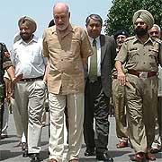 Mr Aziz Ahmed Khan, Pakistans High Commissioner-designate is escorted by Indian officials