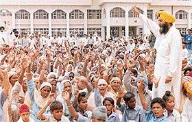 Randhir S. Rakhra and his supporters stage a dharna outside the Deputy Commissioner’s office in Patiala