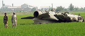 A crashed MiG-23 lies in the paddy fields, about 50 km from Ferozepore, on Monday.
