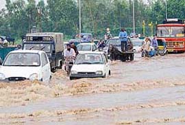 Heavy showers converted roads into streams with waves lapping against the vehicles in Chandigarh