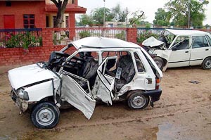 Remnant of the two cars that collided head-on near Kot Shamir village