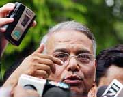 External Affairs Minister Yashwant Sinha talks to the media outside the Prime Ministers residence