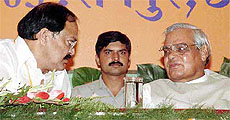 Prime Minister Atal Bihari Vajpayee has a word with BJP President Venkaiah Naidu