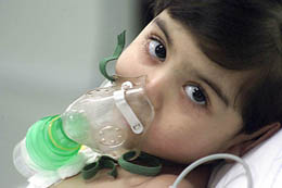 Pakistani child Noor Fatima lies on a hospital stretcher in Bangalore on Saturday.
