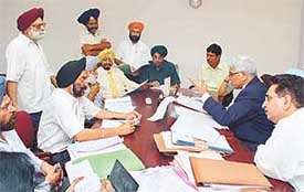 Mr Justice N.K. Sodhi of the Punjab and Haryana High Court-cum-Executive Chairman, SLSA, along with the member, SLSA, Mr Sant Parkash, settle cases in Lok Adalat organised in Chandigarh