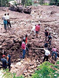 Rescue operations being carried out at Bahang, 4 km from Manali, to extricate bodies of flash-flood victims