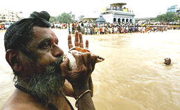 A sadhu blows his conch shell as the Kumbh Mela is declared open on the banks of the Godavari in Nasik town, 180 km northeast of Mumbai, on Wednesday.