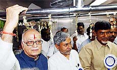 Deputy Prime Minister L.K. Advani, Railway Minister Nitish Kumar and Andhra Pradesh Chief Minister Chandrababu Naidu enjoy a ride