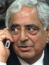Jammu and Kashmir Chief Minister Mufti Mohammad Sayeed talks to Prime Minister Atal Bihari Vajpayee during the inauguration of the cell phone service in Srinagar on Wednesday.