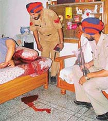 Blood stains on the diwan cover are gory reminder of the murder in SAS Nagar