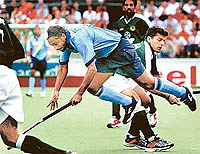 Baljit Dhillon from India is stopped by Ali Raza 