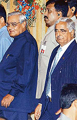 Prime Minister Atal Bihari Vajpayee and Jammu and Kashmir Chief Minister Mufti Mohammad Sayeed arrive for the Inter-State Council meeting in Srinagar on Wednesday.