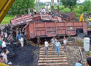 Heavy machinery being used to lift the derailed wagons of a goods train at Mianpur