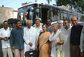 Members of the South-Asian Labour for Peace delegation stand near the Delhi-Lahore bus at Wagah on Friday after attending the conference in Pakistan