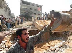 Palestinians search the rubble of Hamas leader, Mahmoud al-Zahar’s house, after an Israeli missile strike in the Gaza Strip on Wednesday.