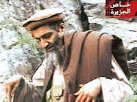 A video grab image from Al-Jazeera television shows what it said is new footage of Al-Qaida leader Osama bin Laden, shot in an unknown location and shown on Thursday.