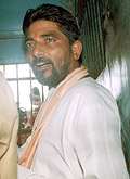 Dara Singh is seated in a police van in Bhubaneswar after being sentenced to death for the killing of Australian missionary Graham Staines by a local court on Monday.