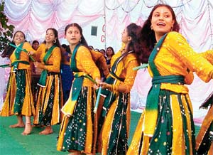 Students of Arya College present dandia raas for the freshers of the NTT course