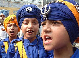 Sikh children wearing traditional dress, participate in a procession on the occasion of the birth anniversary of Guru Ram Dass on Wednesday.