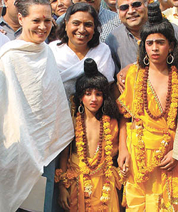 Congress president Sonia Gandhi poses for a photograph with two children dressed as Luv and Kush on the occasion of Maharishi Valmiki Jayanti at her residence in the Capital on Thursday.