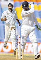 Harbhajan Singh celebrates the dismissal of New Zealand batsman Nathan Astle