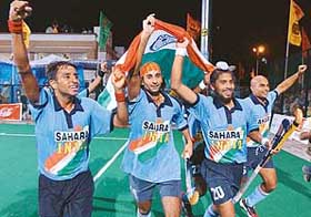 Indian hockey team players with the Tricolour 