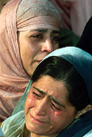 Mourners offer prayers near the coffin of Ghulam Mohammad Ganai, a senior member of the People’s Democratic Party, in Pampore, 15 km south of Srinagar, on Tuesday. Ganai was shot dead by militants.
