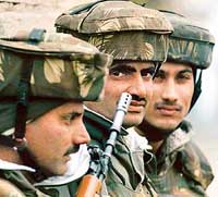 Soldiers stand guard outside a paramilitary camp in Srinagar after an attack by militants on Wednesday.