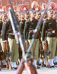 Border Security Force (BSF) soldiers stand during a parade at a garrison in Humhama, on the outskirts of Srinagar, on Friday. The recruits were formally inducted into the BSF after they completed 36 weeks of rigorous training in anti-terrorism and anti-insurgency operations and will be deployed to guard the borders