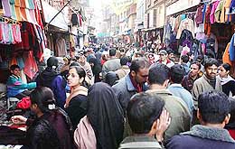 Kashmiris throng the market on the eve of Id as India and Pakistan agreed on a ceasefire starting midnight on Tuesday.