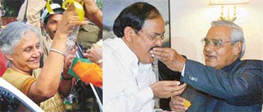 A delighted Sheila Diskhit waves to her supporters and Prime Minister Atal Bihari Vajpayee offers sweets to party President Venkaiah Naidu after the BJP swept to power in Rajasthan, MP and Chhattisgarh on Thursday