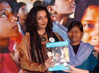 Bollywood actress Shabana Azmi with tribal girl Lalita after releasing the UNICEF report