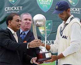 Indian captain Sourav Ganguly accepts the Border-Gavaskar Trophy from Sunil Gavaskar and Allan Border 