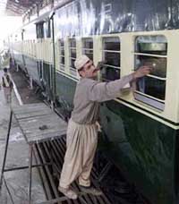 Pakistan railway staff renovate the coaches of the Samjhauta Express on Wednesday at Lahore railway station.