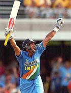 VVS Laxman celebrates after hitting a boundary off the last ball of the Indian innings to bring up his 100 against Australia in Brisbane
